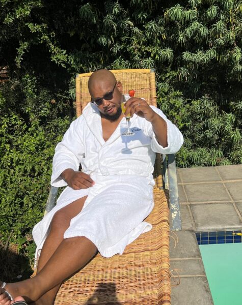 Male client carrying champagne