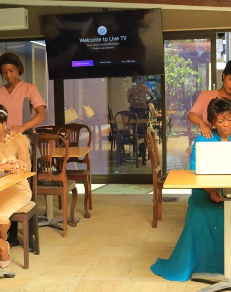 Massage therapists massaging clients at their workplace